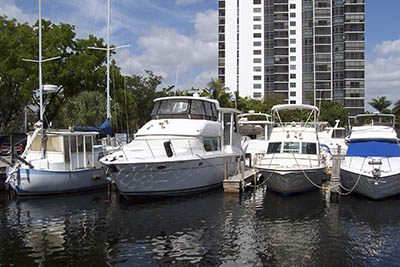 Four docked boats and a building in the back